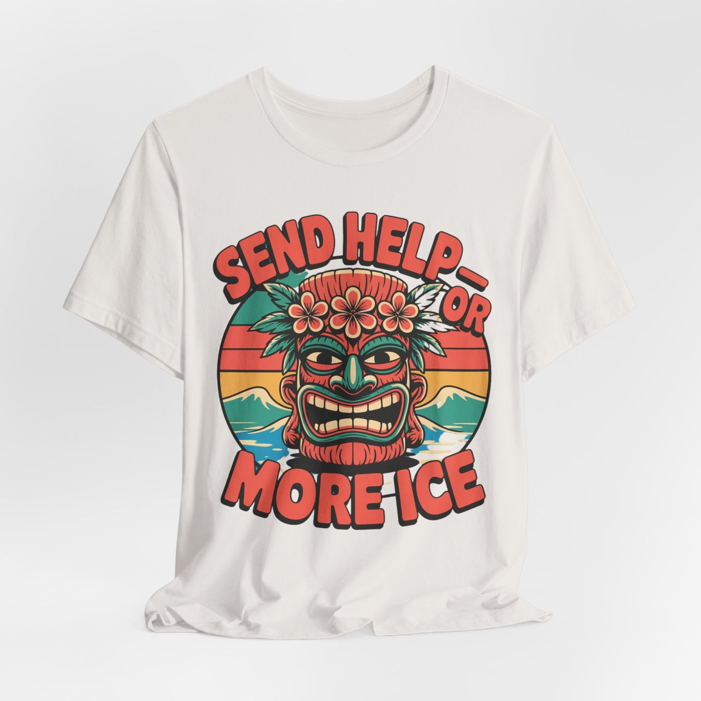 The Tropical Vibe Unisex Tiki T-Shirt - Send Help or More Ice showcases a vibrant tiki mask, flowers, and sunset, with bold red text SEND HELP—OR MORE ICE for a playful tropical look ideal for summer festivals.