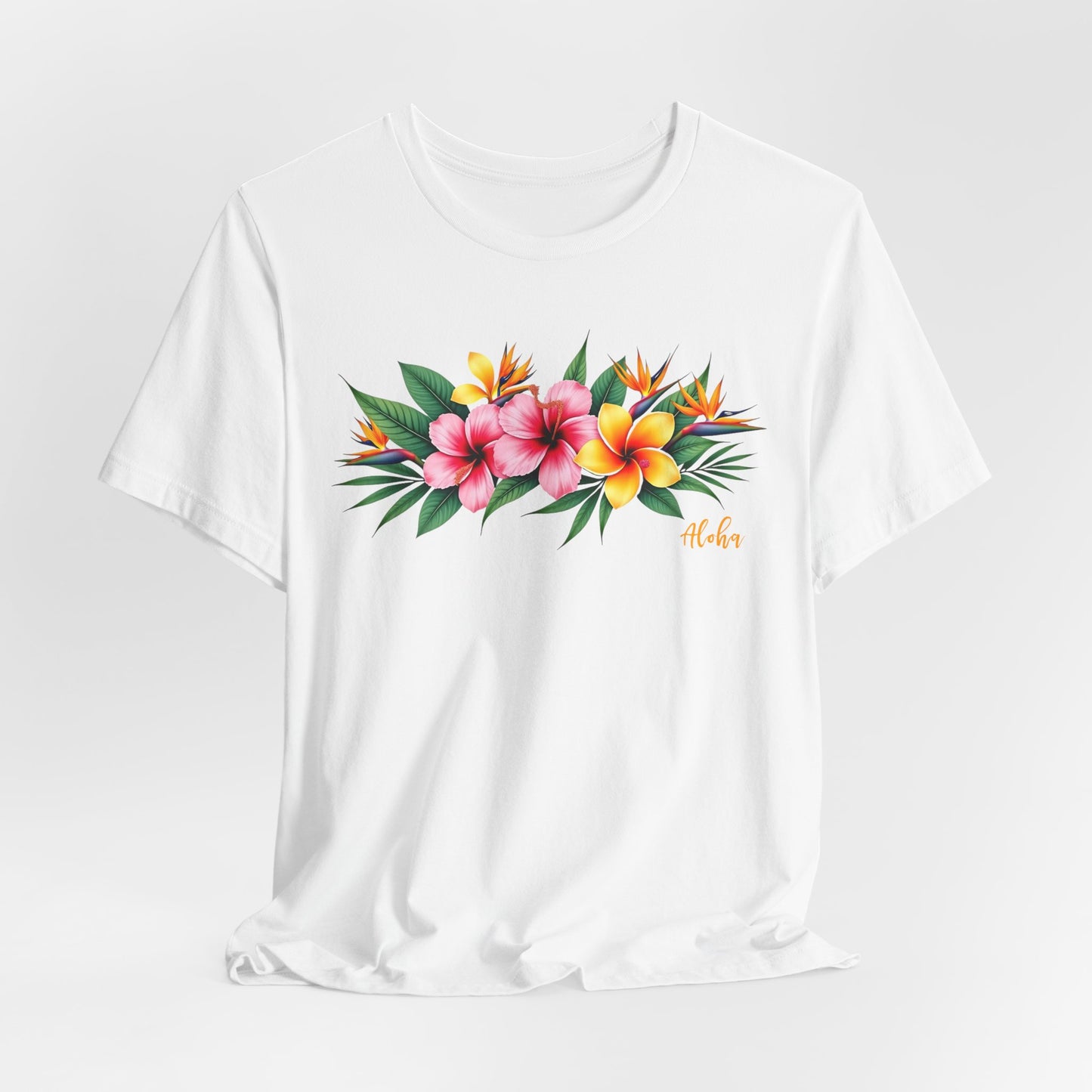 The Tropical Floral Unisex Jersey T-Shirt - Perfect for Summer Vibes features a vibrant print of pink, red, orange, and yellow tropical flowers on Airlume cotton with Aloha in orange script on the right side.