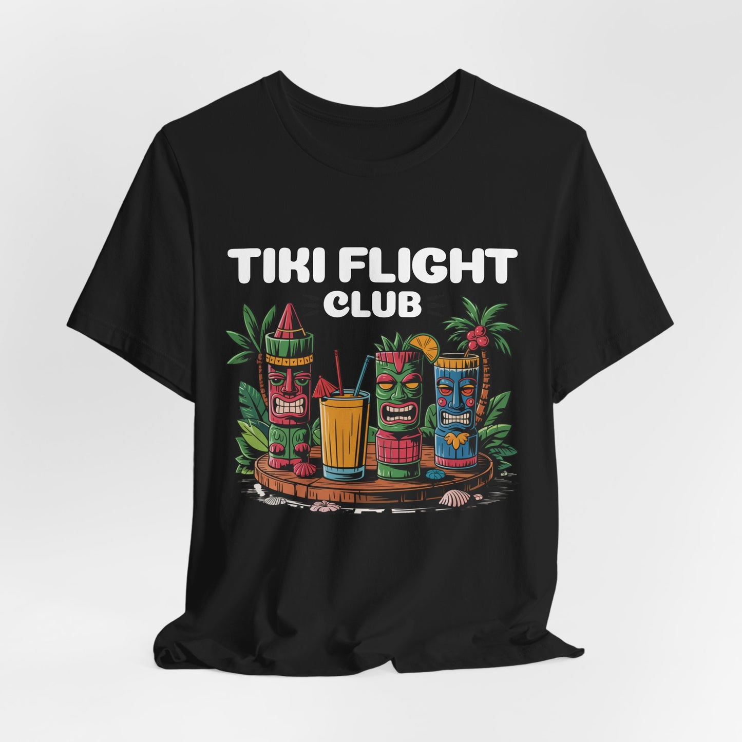 The Tiki Flight Club Graphic Tiki T-Shirt - Unisex Summer Vibe T-Shirt features vibrant tiki masks, tropical drinks, flowers, and leaves with bold TIKI FLIGHT CLUB text—perfect for beach days and casual summer style.