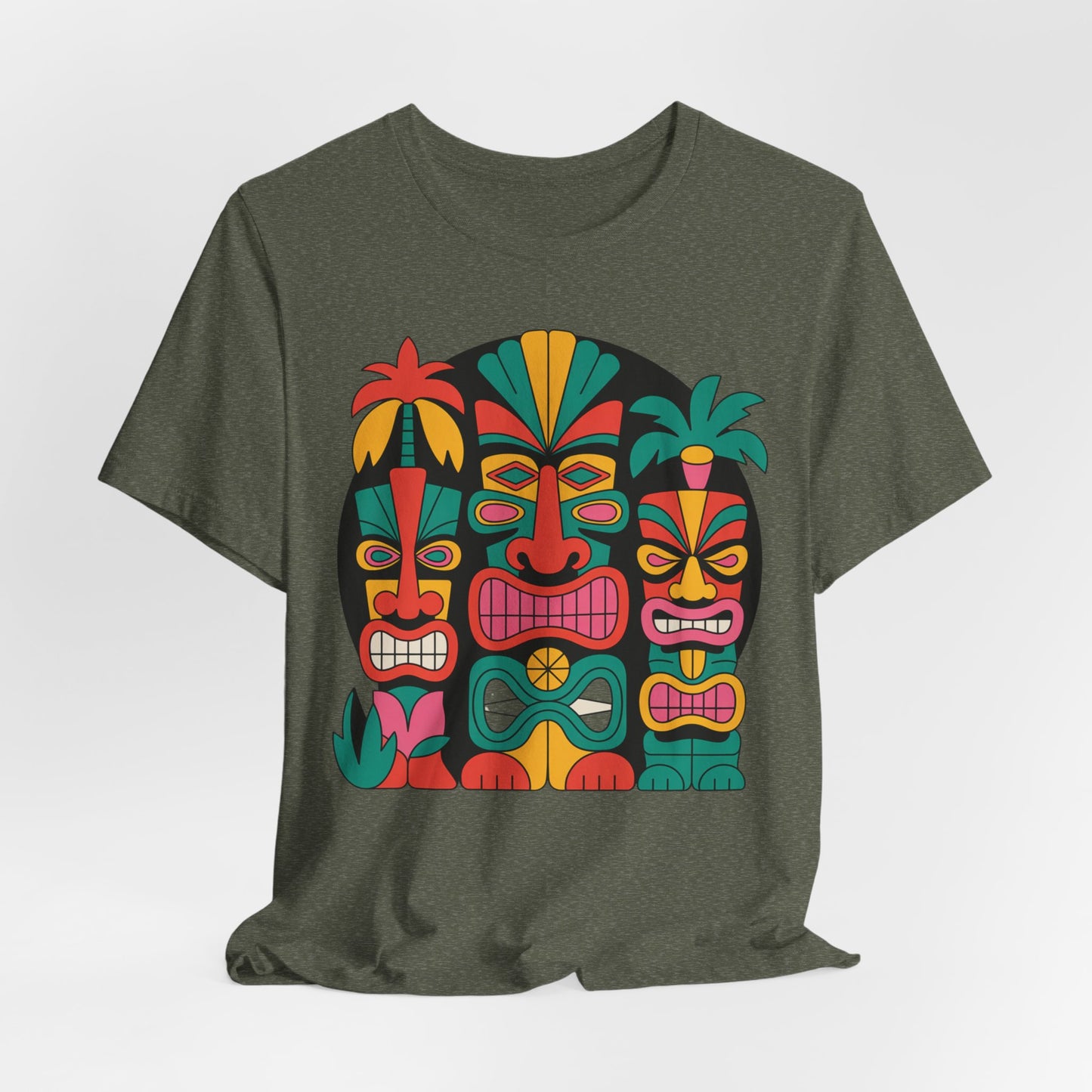 The Tiki Vibes Unisex Tiki T-Shirt is a dark green tee with four colorful tiki masks, bold expressions, and tropical leaves and flowers—perfect for beach lovers seeking a true island vibe.