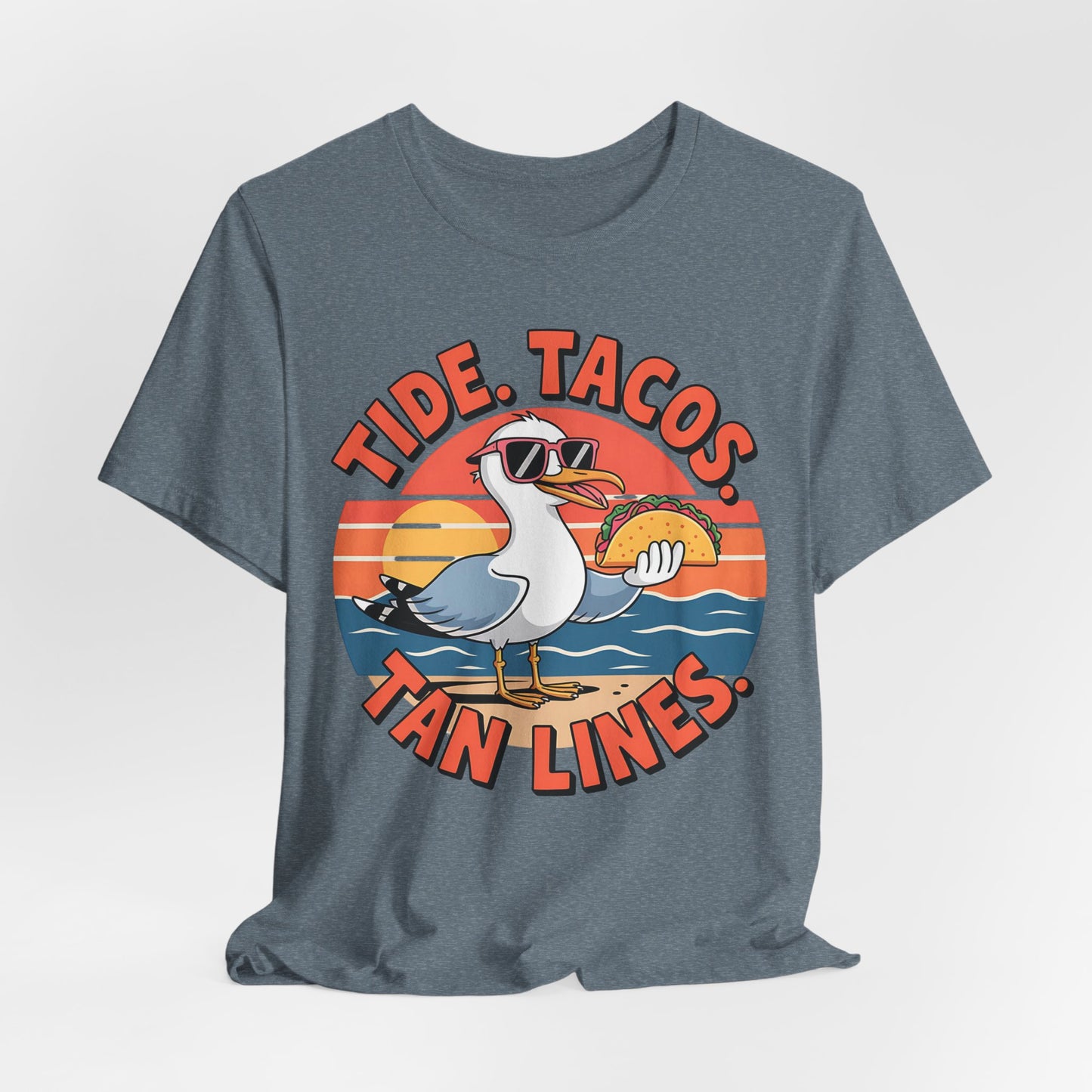 The Beach Vibes Unisex T-Shirt – Tide, Tacos, Tan Lines Summer Shirt features a cartoon seagull in sunglasses holding a taco with a sunset background. Perfect for beach lovers and summer vacations.