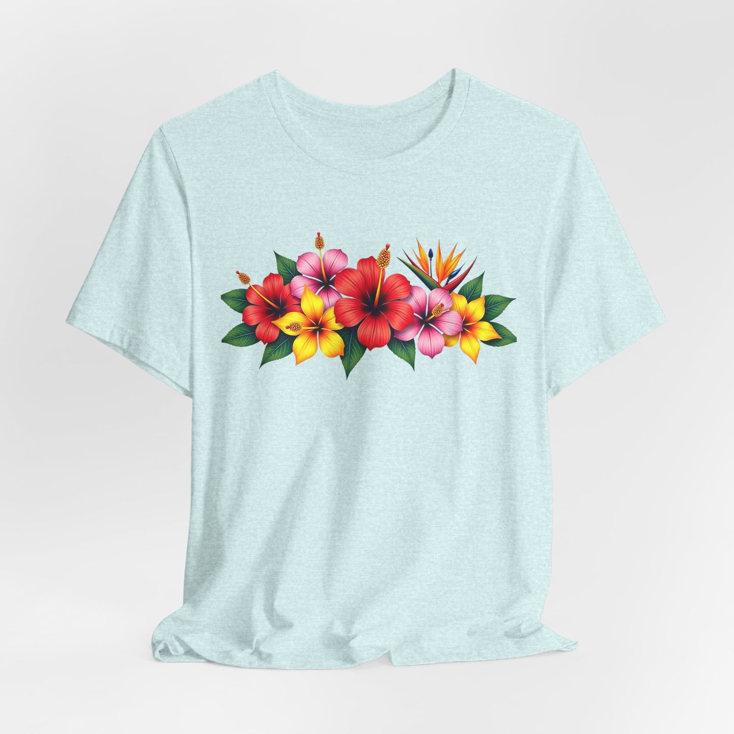 The Tropical Floral Unisex T-Shirt - Bright & Vibrant Summer Shirt showcases a lively print of red, pink, and yellow tropical flowers with green leaves—ideal for fans of bohemian style and summer fashion.