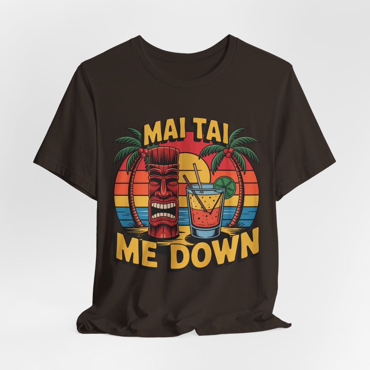 The Mai Tai Me Down Unisex Tiki T-Shirt - Tropical Vibes Summer Shirt features soft Airlume combed cotton, a sunset, palm trees, tiki head, Mai Tai cocktail, and bold MAI TAI ME DOWN text for a fun tropical look.