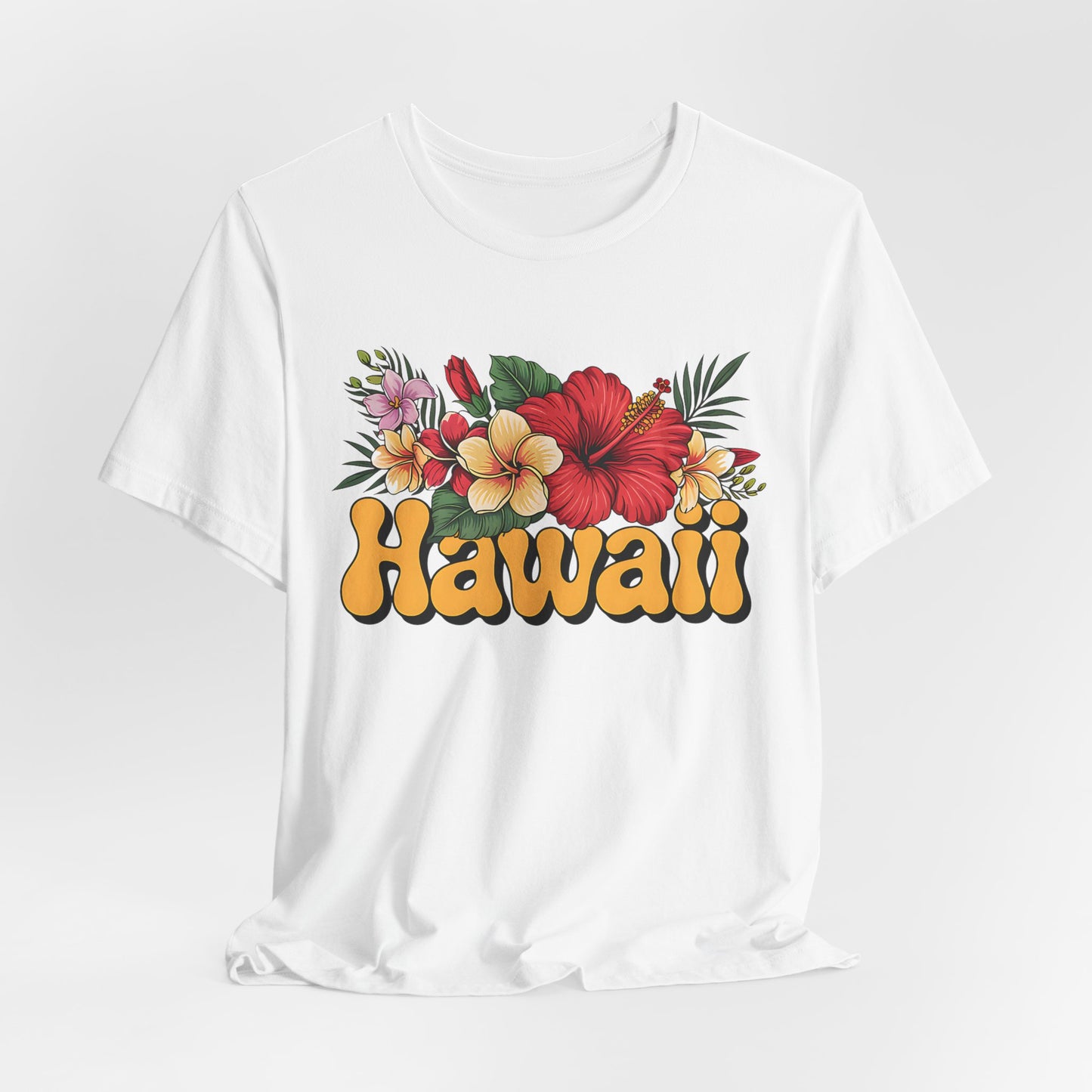 The Hawaiian Floral Unisex Tee features soft Airlume cotton and a vibrant red, yellow, and pink hibiscus print with bold yellow Hawaii text—perfect for beach vibes and island spirit.