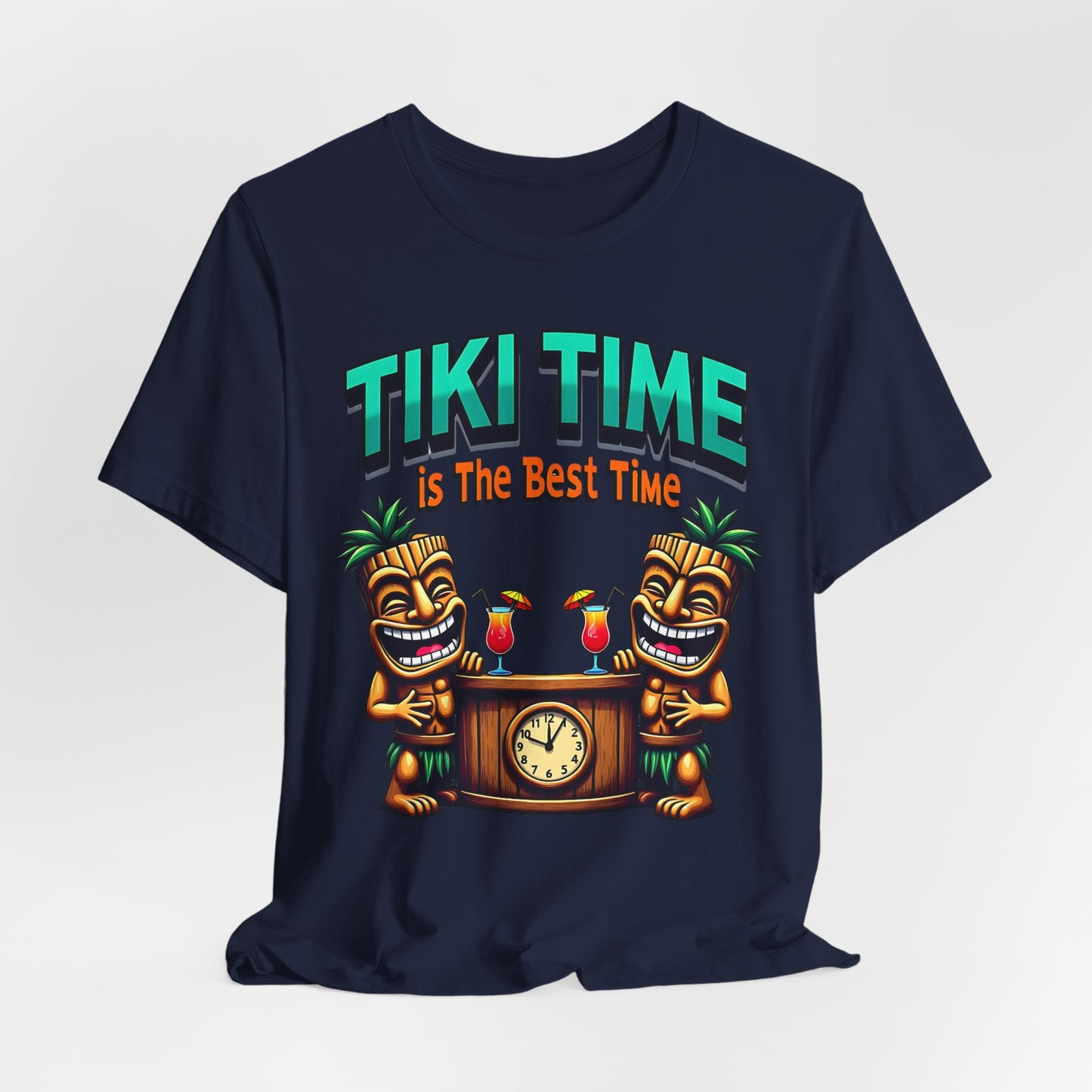 The Tiki Time Unisex Jersey T-Shirt features a vibrant tropical graphic with two smiling tiki figures and drinks by a clock, plus bold “TIKI TIME is The Best Time” text. Made from soft Airlume combed cotton—perfect for beach lovers.