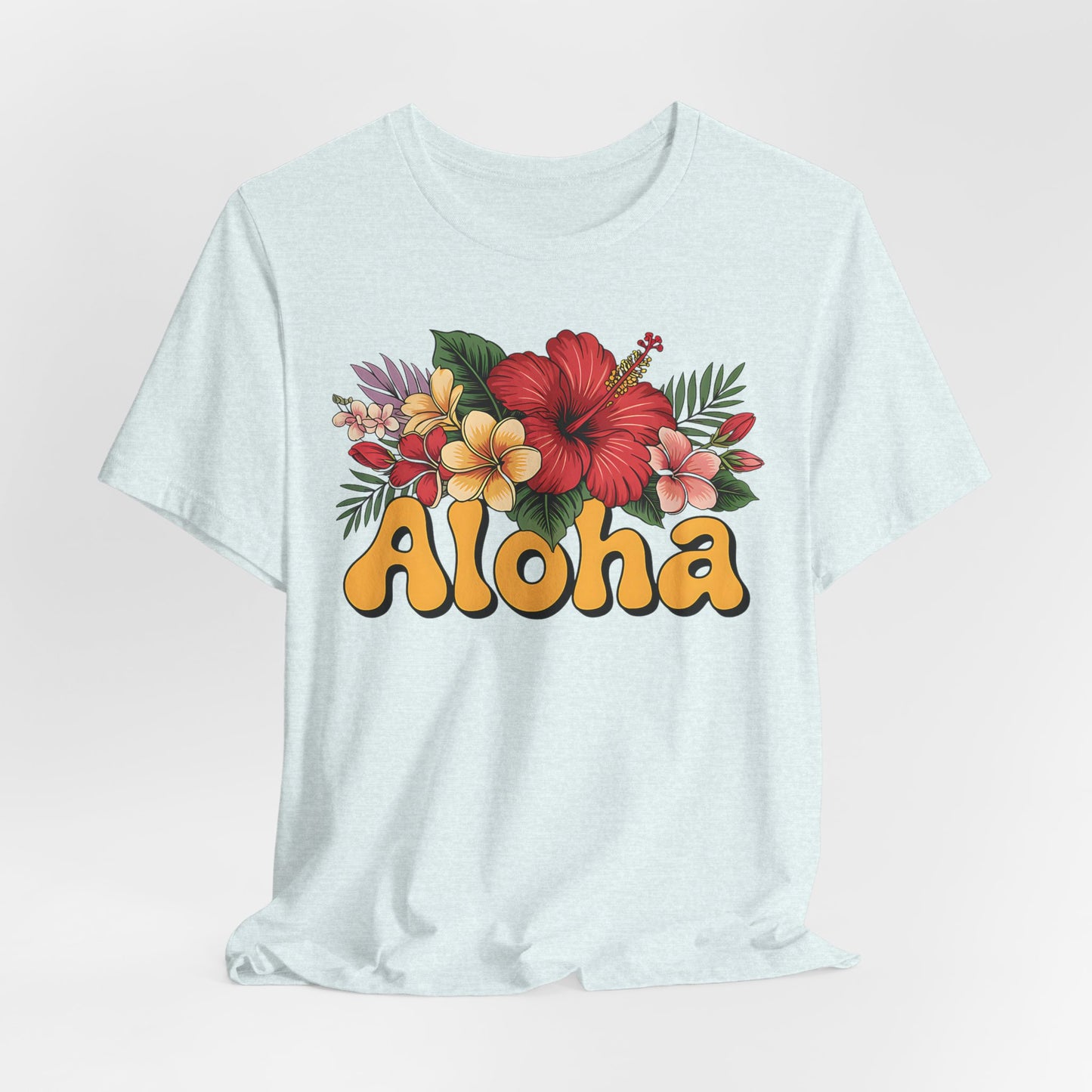 The Aloha Floral Unisex Jersey T-Shirt - Tropical Vibes, Casual Summer Style features a light blue tee with colorful hibiscus and plumeria flowers above bold yellow Aloha, made from soft Airlume cotton for lasting comfort.