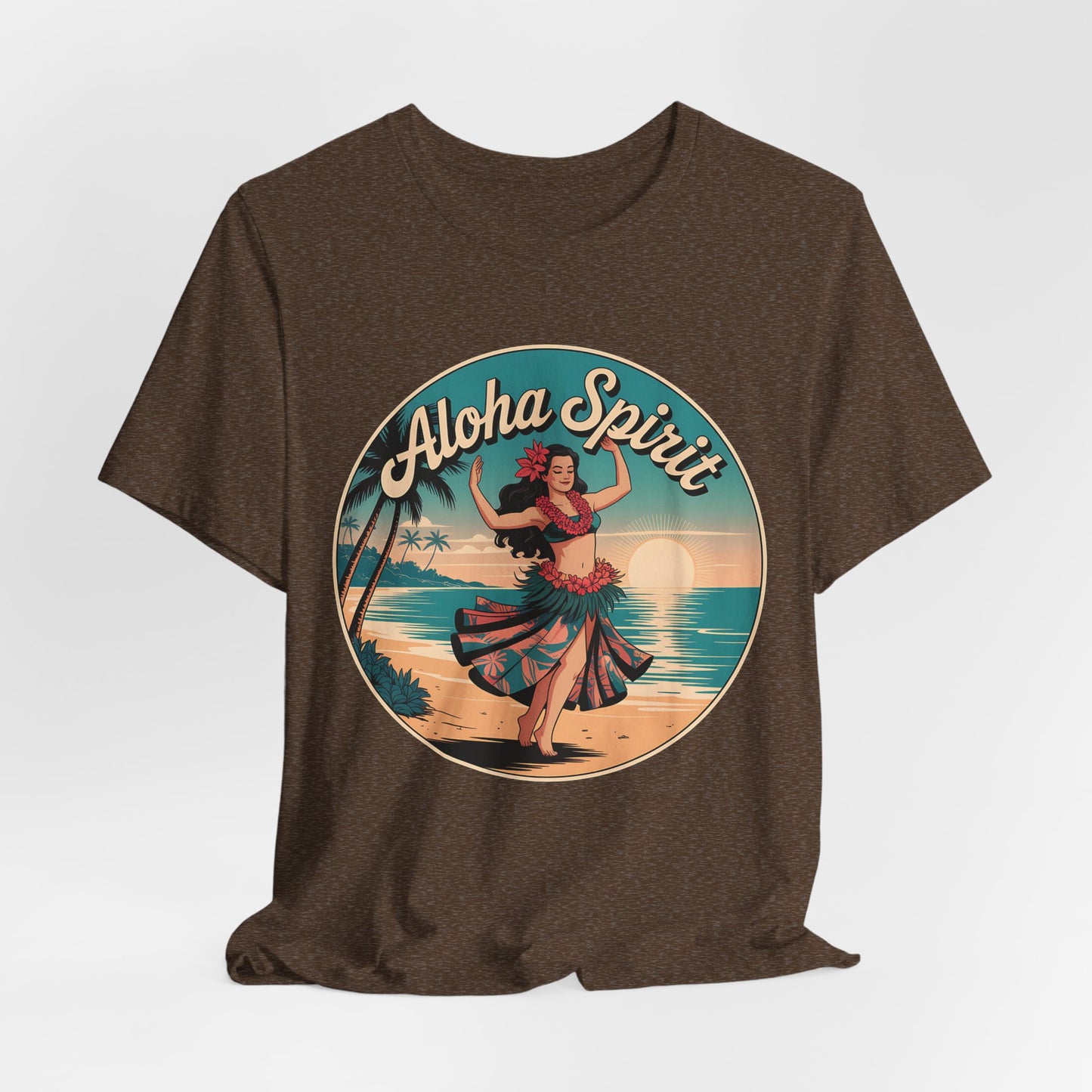 The Aloha Spirit Graphic T-Shirt features a vintage hula dancer on a sunset beach, surrounded by palm trees and waves, with “Aloha Spirit” in bold cursive—perfect for island dreamers and beach lovers.