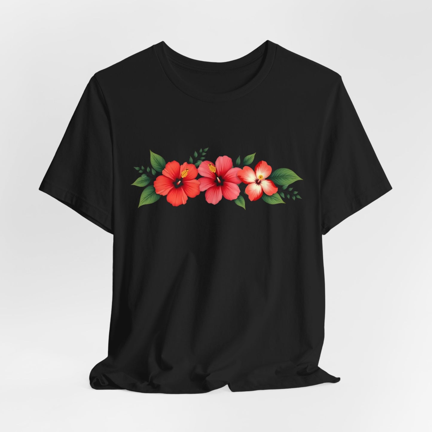 Floral Unisex Short Sleeve T-Shirt - Perfect for Spring and Summer. Features a bold design with three red and pink hibiscus flowers and green leaves on the chest. Made from 100% Airlume cotton, shown on a plain white background.
