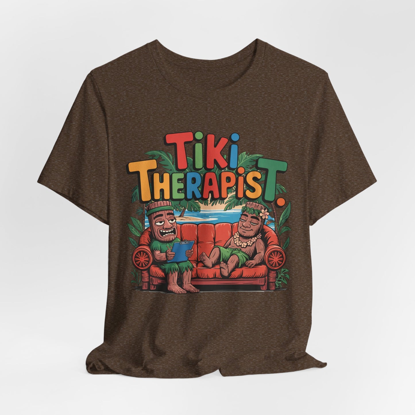 Tiki Therapist Unisex Tiki T-Shirt – a breathable cotton tee with colorful Tiki Therapist text above two cartoon tikis on a red couch, lush plants in the background. Fun Hawaiian graphic for beach lovers.