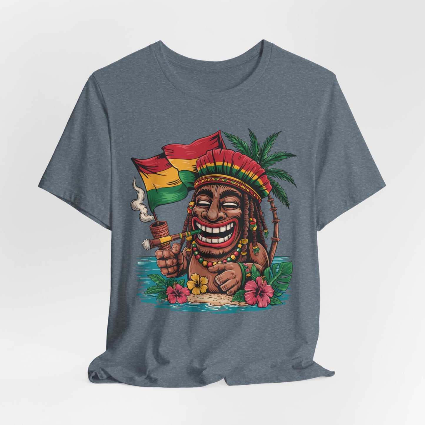 The Tropical Vibes Unisex Jersey Tiki T-Shirt features a lively island tiki design with a smiling cartoon character in a red, yellow, and green headdress, holding a flag and pipe among palm trees and colorful flowers.
