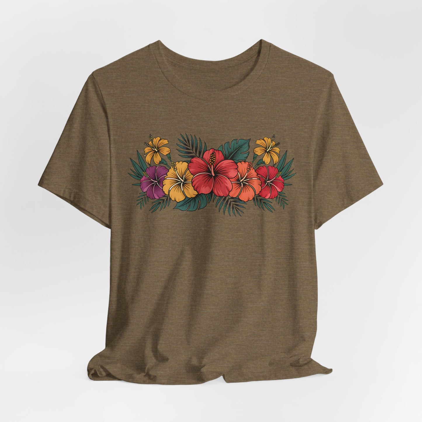 The Tropical Floral Unisex T-Shirt - Perfect for Summer Days features a vibrant hibiscus floral design in red, yellow, and purple on olive green Airlume combed cotton, shown against a light background.