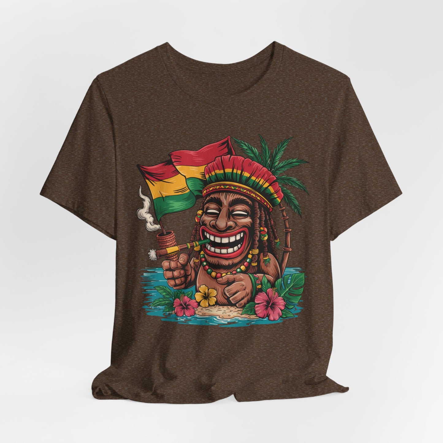 The Tropical Vibes Unisex Jersey Tiki T-Shirt features a playful cartoon with dreadlocks, a bright headdress, and flag, relaxing with a pipe on a tropical beach with palm trees and hibiscus flowers.