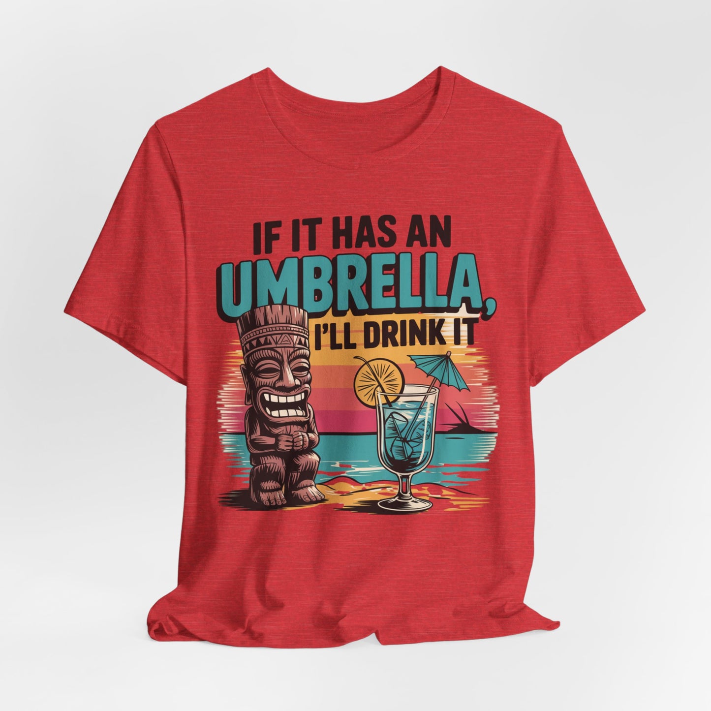 The Tropical Fun Tiki T-Shirt features a retro sunset with a tiki statue, cocktail, and the phrase: If it has an umbrella, Ill drink it. This red unisex shirt is perfect for embracing tropical vibes.
