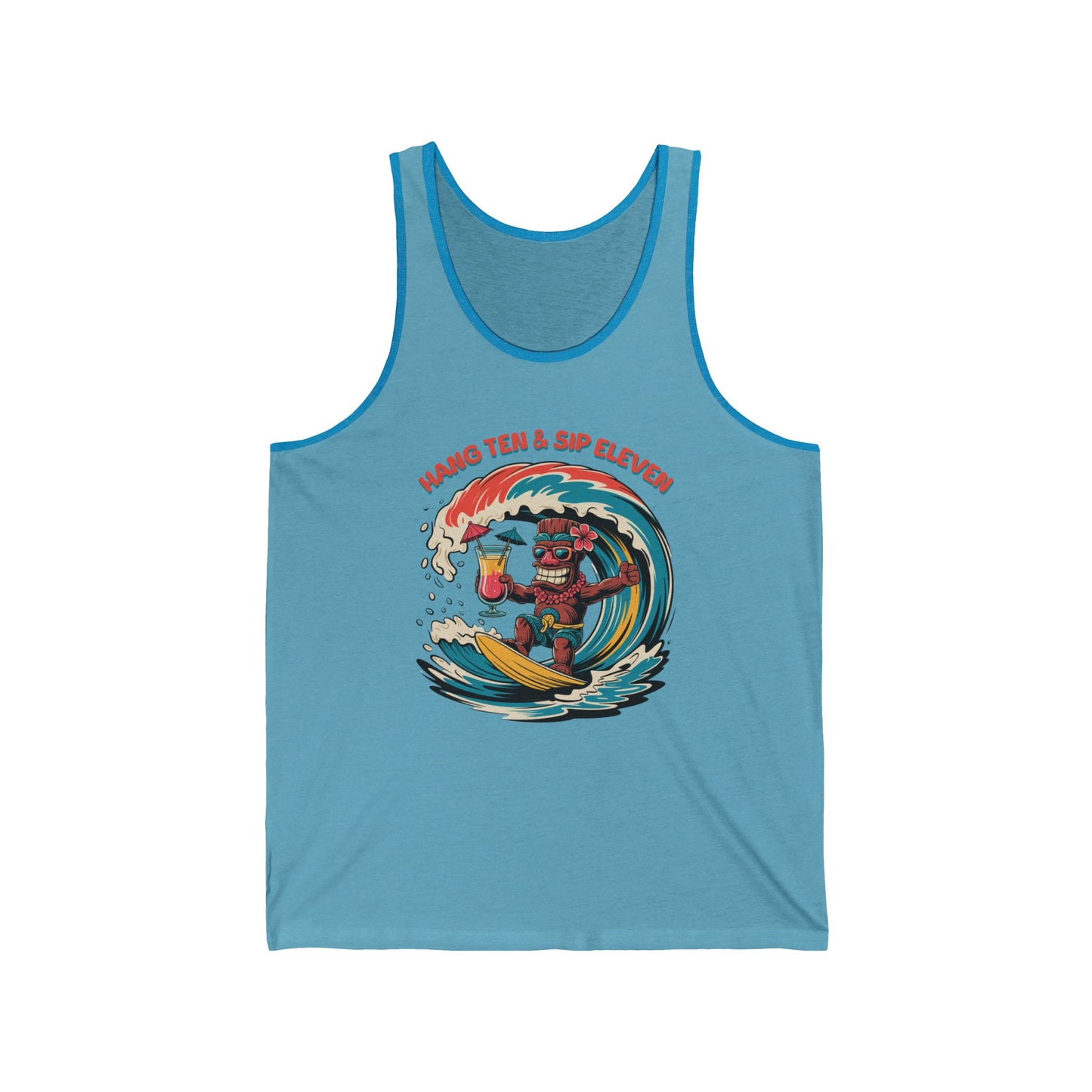 The Hang Ten and Sip Eleven Tiki Tank Top is a light blue unisex jersey featuring a cartoon tiki surfing with a drink. “Hang Ten & Sip Eleven” appears above in red text. Made from soft Airlume combed cotton for comfort.