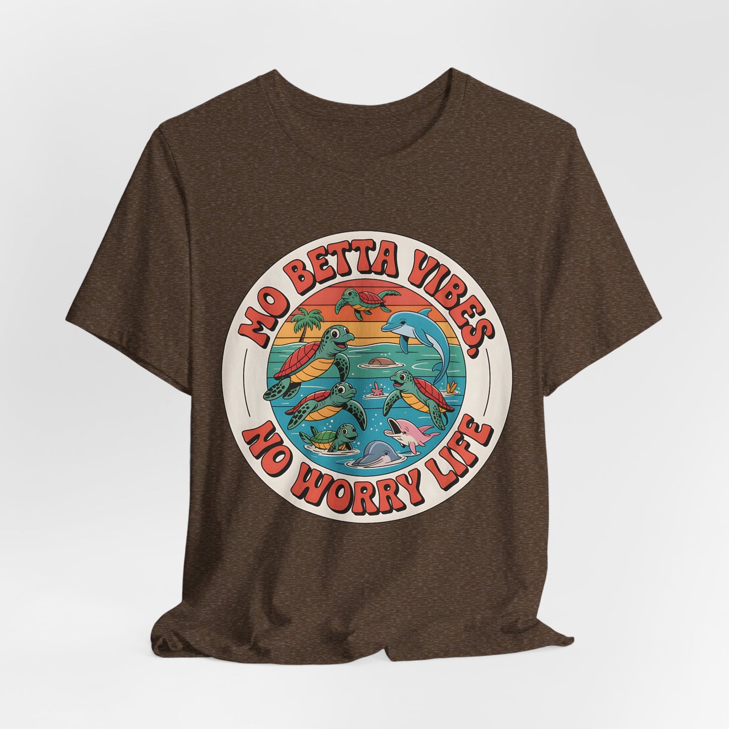 The Mo Betta Vibes Unisex Jersey T-Shirt features a brown, relaxed fit with a colorful retro graphic of sea turtles, dolphins, and waves plus the uplifting message: NO BETTA VIBES, NO WORRY LIFE—perfect for your casual summer wardrobe.