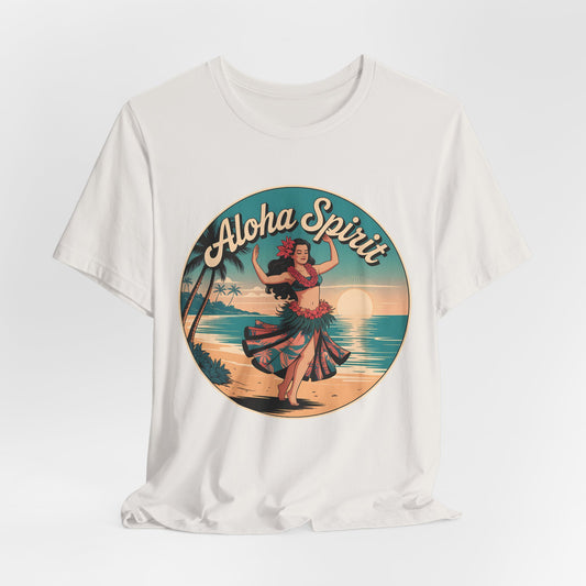 The Aloha Spirit Graphic T-Shirt- Hula Dancer T-Shirt features a vintage-style design with a hula dancer, palm trees, and ocean sunset in a circular frame—ideal for beach lovers and island dreamers.