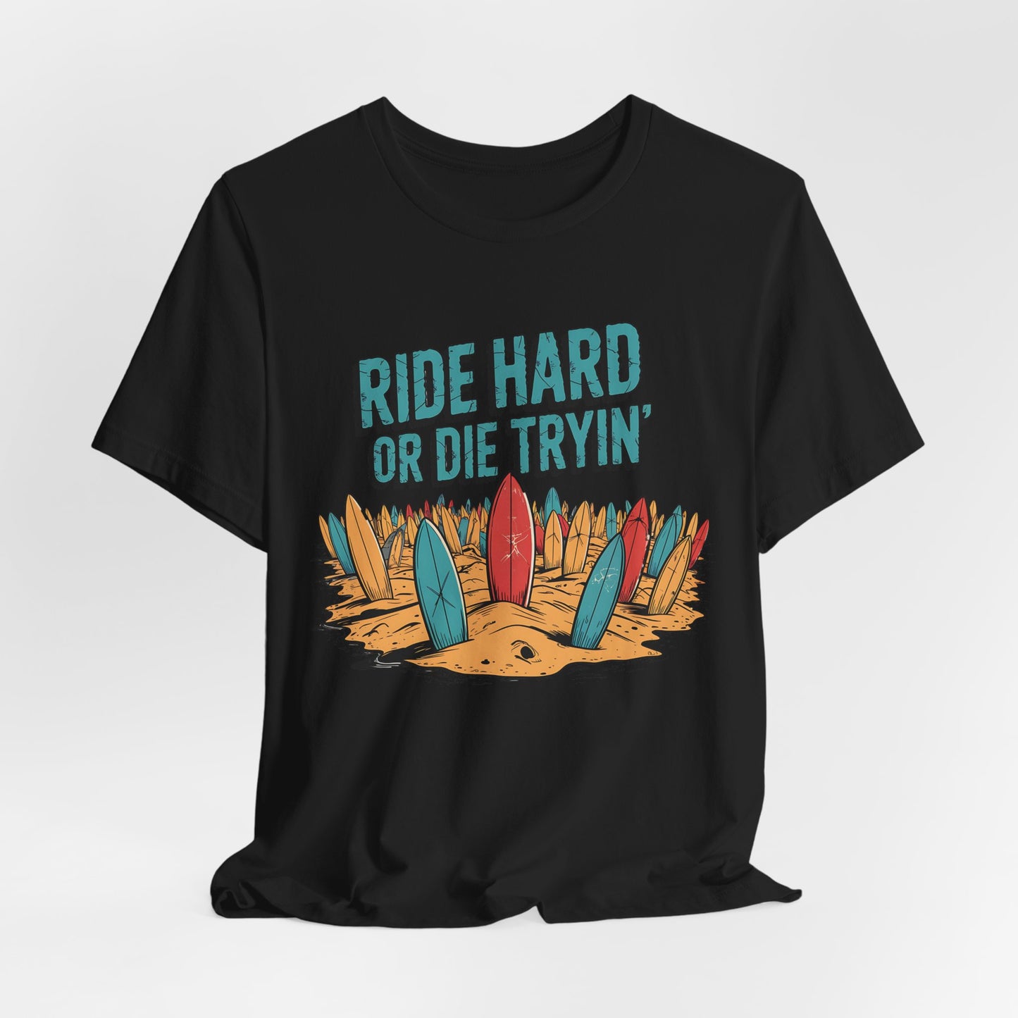 The Surfing T-Shirt - Ride Hard or Die Tryin is a black unisex jersey tee with colorful surfboards in sand and bold blue lettering—ideal for beach lovers who live for adventure and the surf lifestyle.