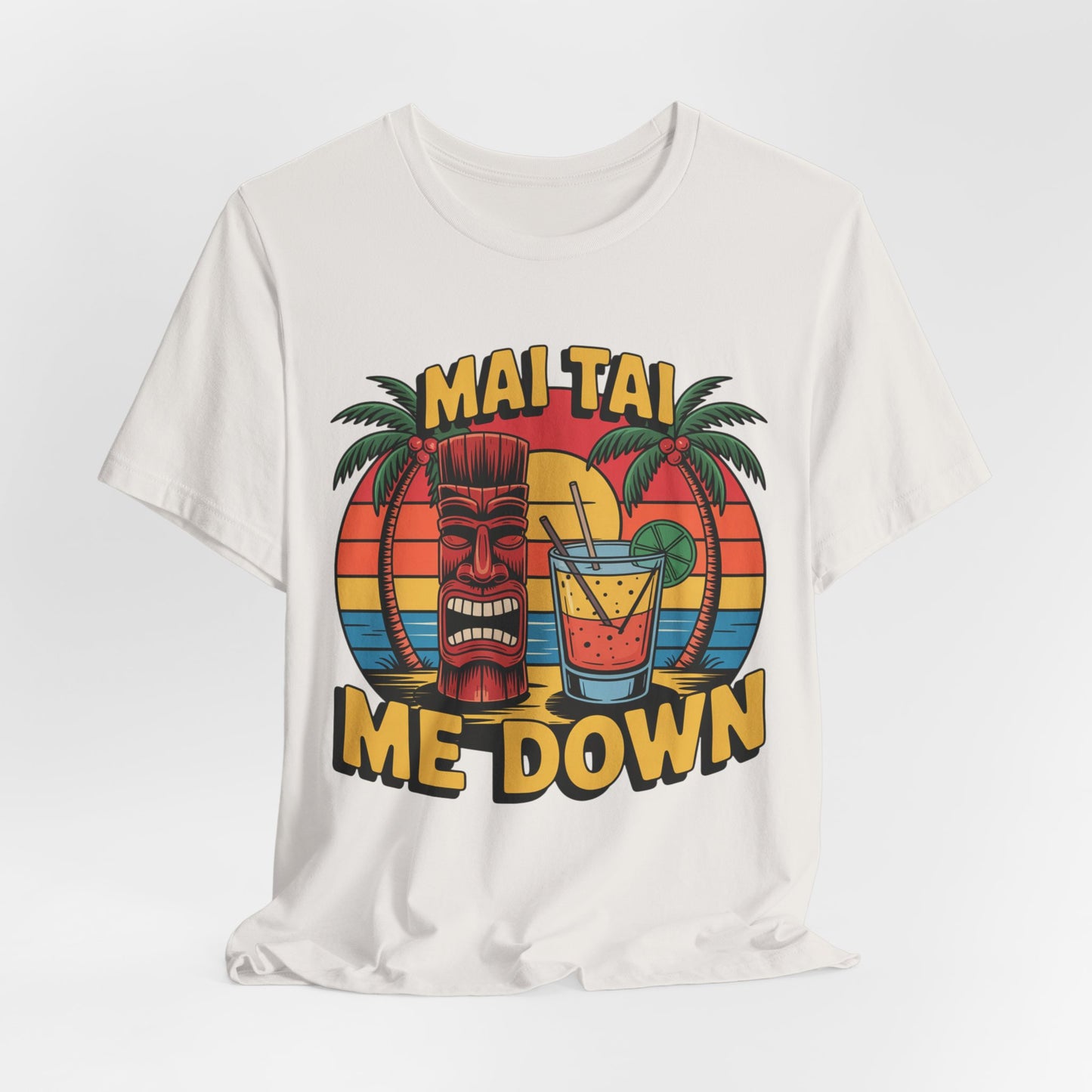 The Mai Tai Me Down Unisex Tiki T-Shirt - Tropical Vibes Summer Shirt features tropical drinks artwork with a tiki face, palm trees, sunset, and MAI TAI ME DOWN in bold yellow on soft Airlume combed cotton.
