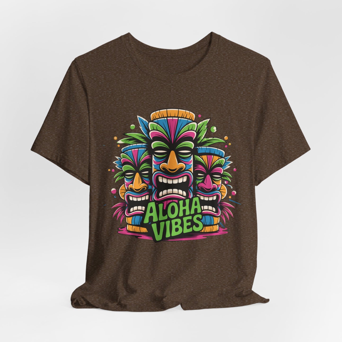 The Aloha Vibes Unisex Short Sleeve Tiki T-Shirt features three colorful tiki masks above Aloha Vibes in bold letters—a breathable cotton tee perfect for beach lovers and summer festivals with its vibrant, tropical design.