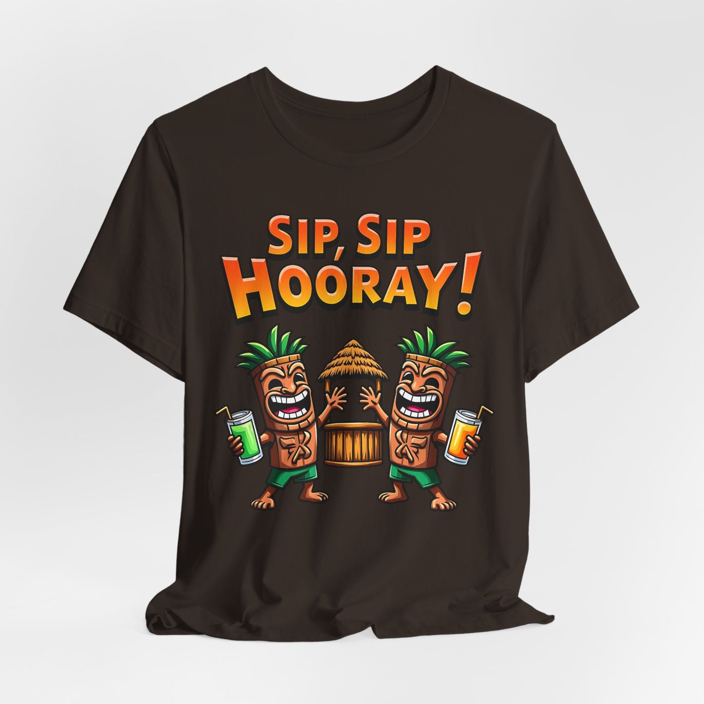 The Sip Sip Hooray Tropical Unisex Tiki T-Shirt is black and displays two cartoon tiki characters with drinks by a hut, topped with bold orange ‘Sip, Sip, Hooray!’ text.