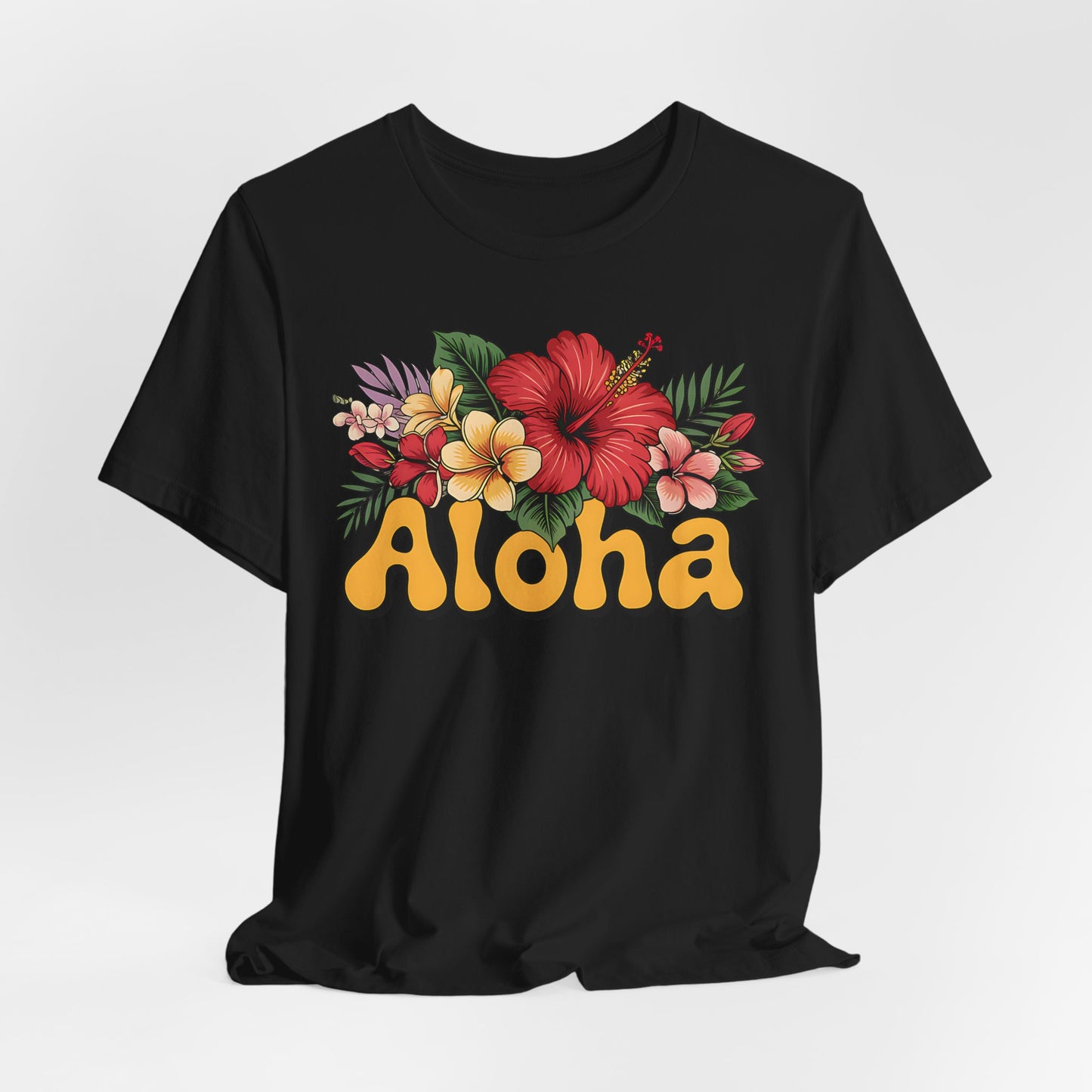 The Aloha Floral Unisex Jersey T-Shirt offers tropical vibes with colorful flowers above bold yellow Aloha letters, crafted from soft Airlume cotton for casual summer style and ultimate comfort.