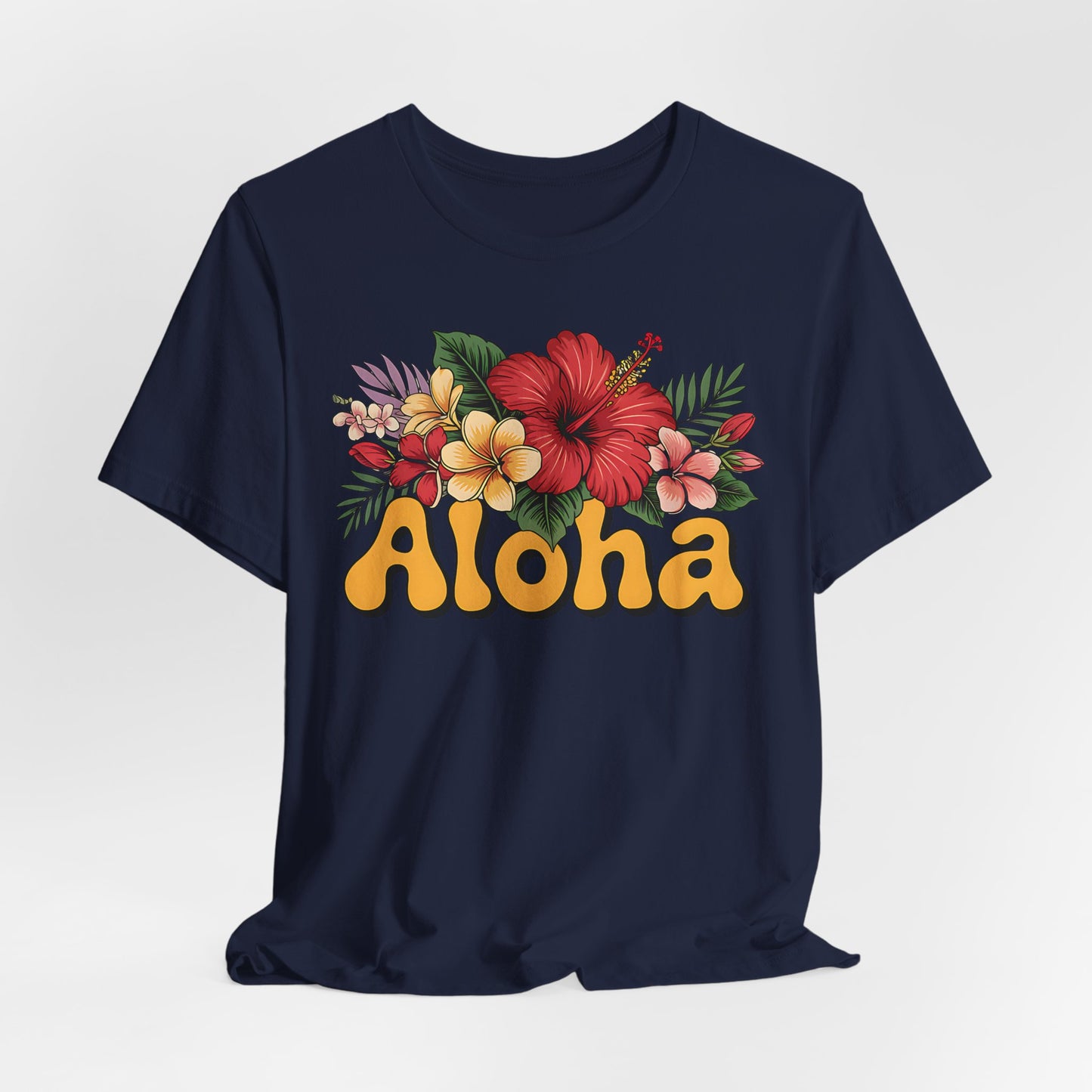 The Aloha Floral Unisex Jersey T-Shirt features soft Airlume cotton, colorful tropical flowers, and bold yellow retro Aloha lettering—perfect for casual summer style and tropical vibes.