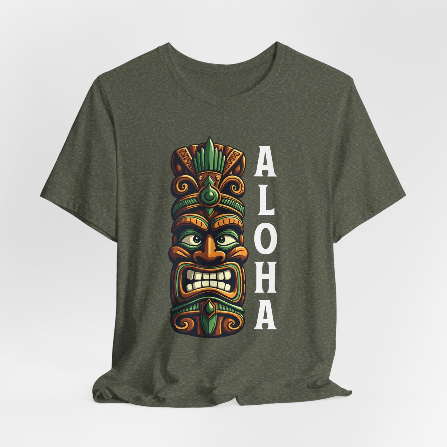 The Aloha Tiki Graphic T-Shirt for Beach Lovers features a colorful tiki mask and bold ALOHA letters—an olive green unisex jersey tee perfect for anyone wanting a tropical vibe.