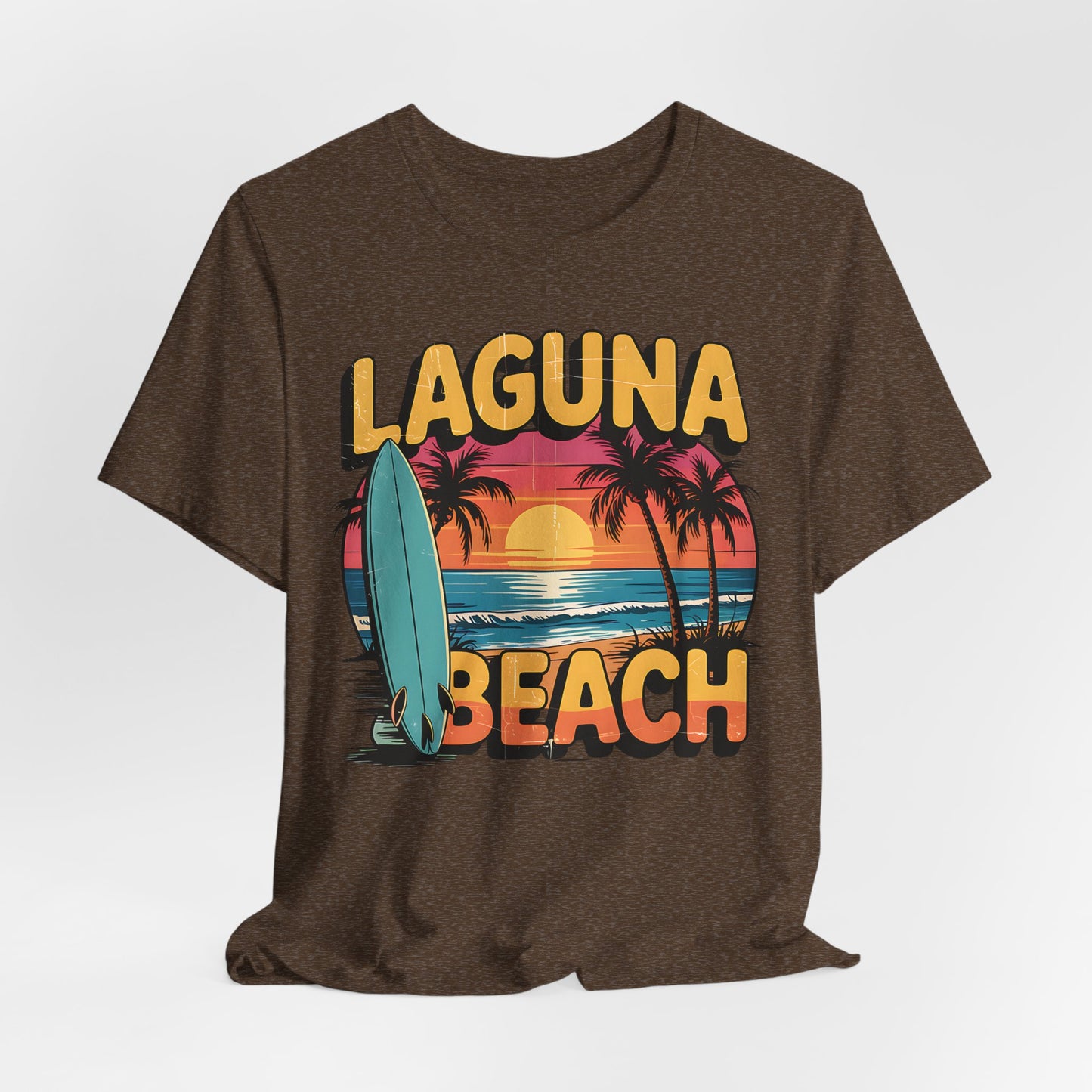 The Laguna Beach Sunset Surf Tee is a unisex jersey short sleeve t-shirt featuring vibrant sunset, palm trees, ocean waves, and a surfboard graphics—perfect for your next beach adventure.