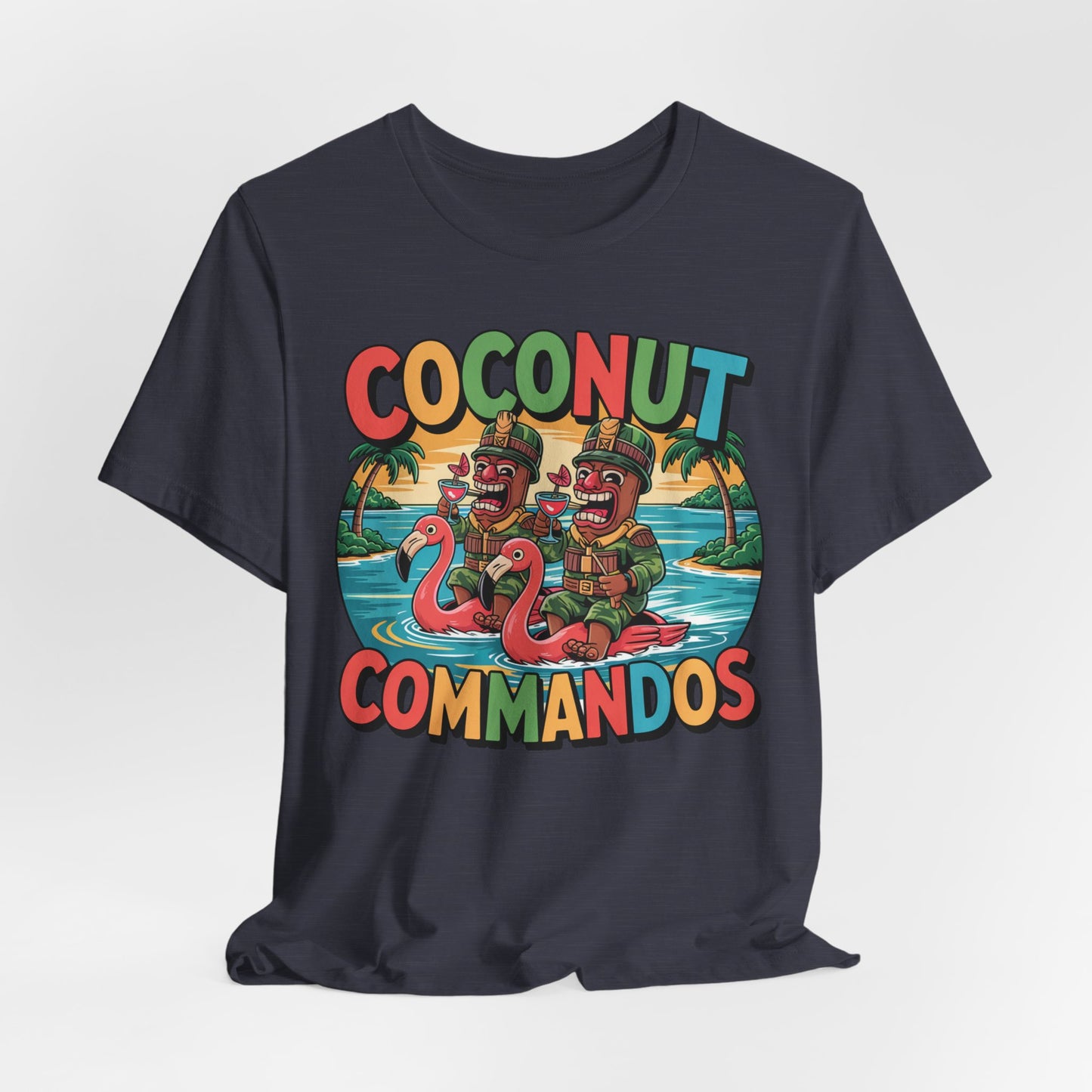 The Coconut Commandos Graphic Tiki T-Shirt features cartoon soldiers on pink flamingo floats, palm trees, and bold multicolored text—a perfect unisex pick for beach lovers who want a playful summer vibe.