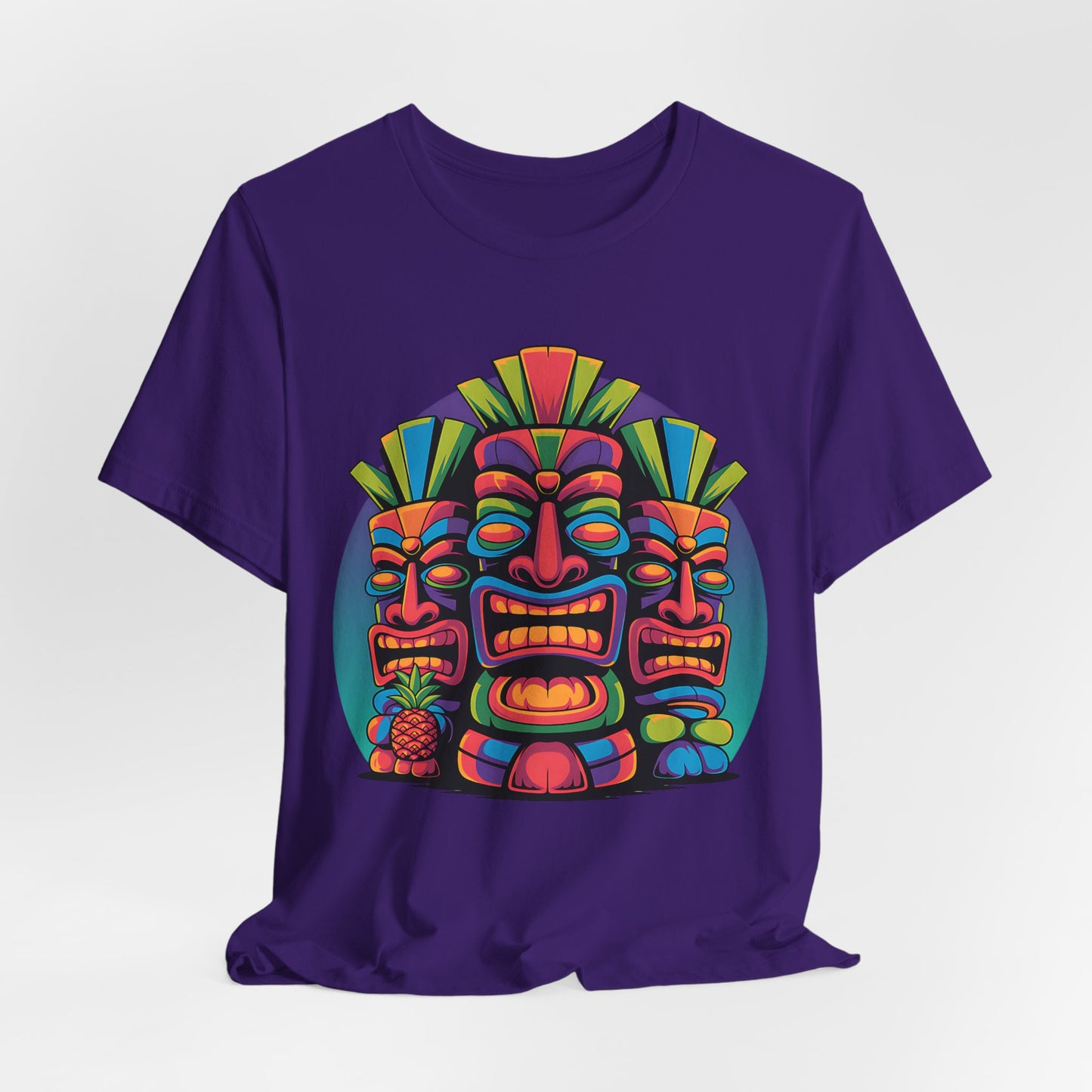 The Vibrant Tribal Mask Tiki T-Shirt - Unisex Short Sleeve features three bold tiki masks with tropical accents like a pineapple and geometric shapes—a unique, eye-catching addition to any casual outfit.
