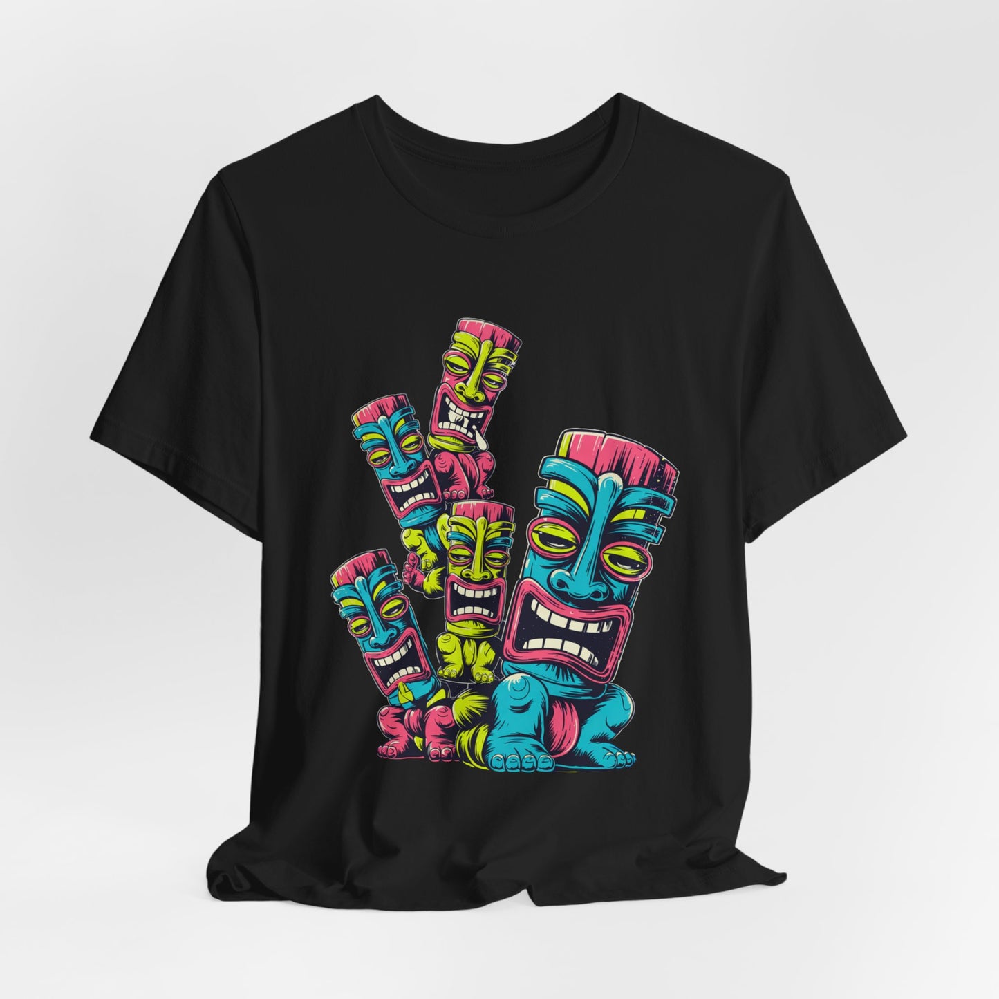 The Vibrant Tiki Art Unisex Jersey Tiki T-Shirt showcases five colorful stacked tiki masks in blue, yellow, pink, and green on a black tee, printed with vivid DTG technology for a bold and fun casual style.