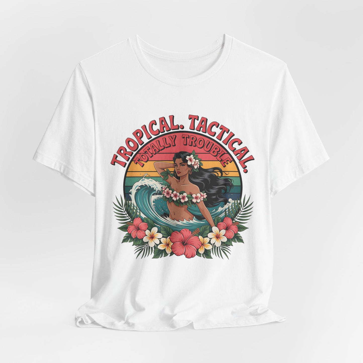 The Tropical Tactical Unisex Jersey T-Shirt - Aloha Vibes & Summer Fun features a vintage hula dancer with flowers, waves, and sunset. Made from soft Airlume combed cotton with “Tropical Tactical” above and “Totally Trouble” below the print.