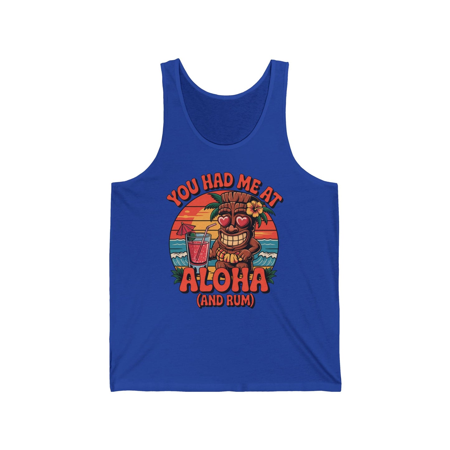 Celebrate beach culture in the Aloha Tiki Tank Top: Unisex Jersey Tank with a tropical vibe—featuring a heart-eyed tiki face, drink, palm trees, sunset, and the phrase YOU HAD ME AT ALOHA (AND RUM).