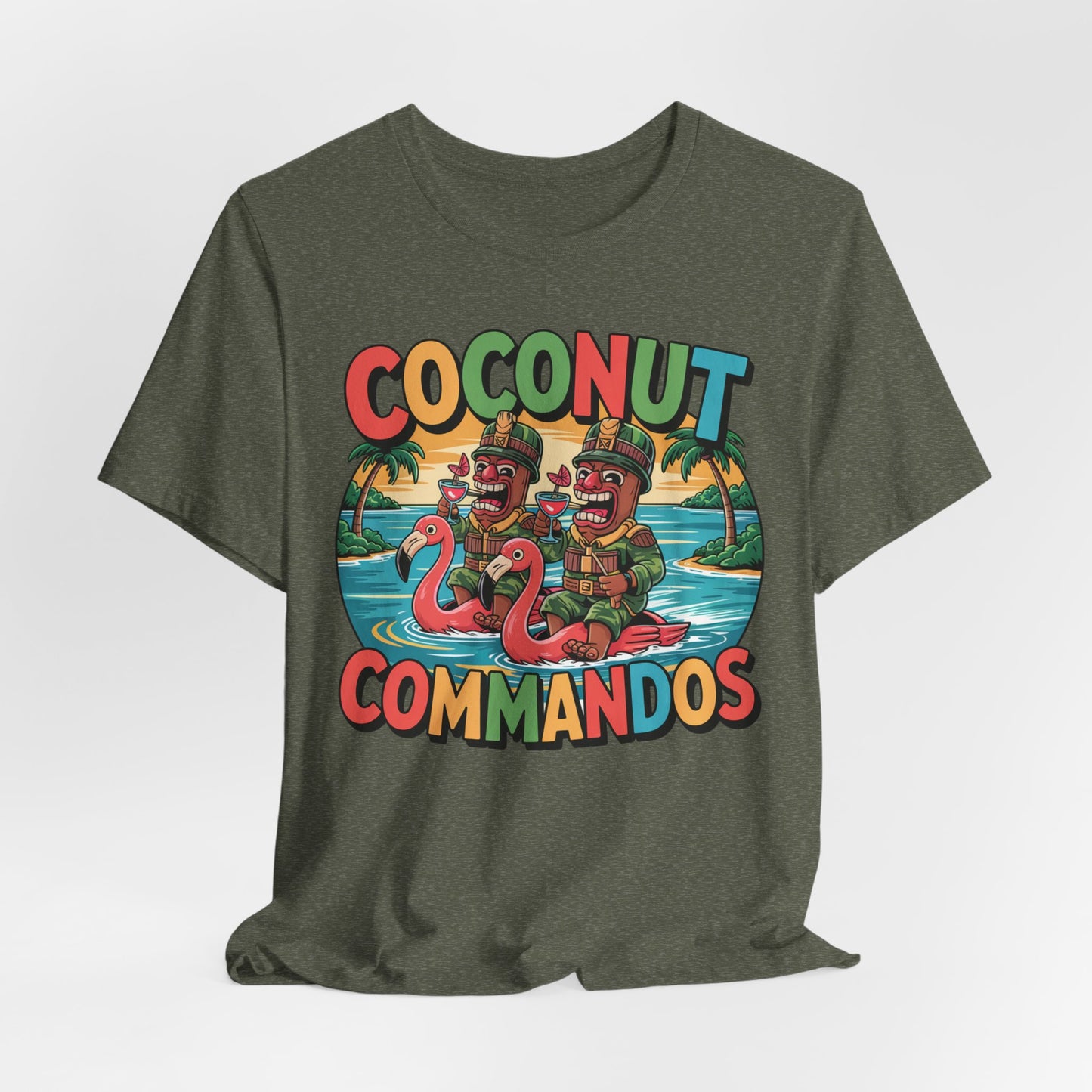 The Coconut Commandos Graphic Tiki T-Shirt features cartoon Commandos on flamingo floats amid palm trees and a sunset, creating a playful summer vibe—perfect for beach lovers.