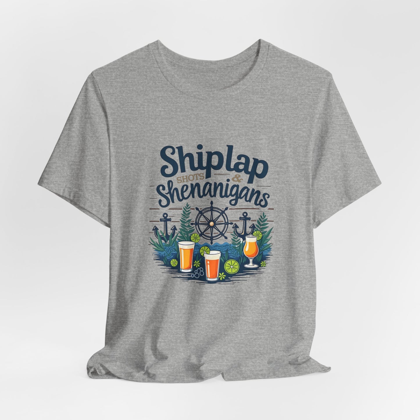 The Shiplap Shenanigans Unisex Short Sleeve Tee—perfect for brewery lovers—features “Shiplap Shots & Shenanigans” with nautical graphics on soft Airlume cotton, making it a relaxed and stylish wardrobe staple.