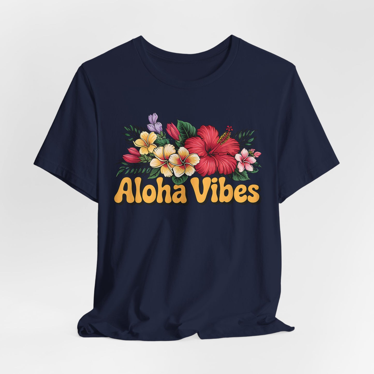 The Aloha Vibes Floral Unisex T-Shirt for Island Vibes is a navy tee with vibrant hibiscus and plumeria prints above bold yellow Aloha Vibes text, made from breathable fabric for all-day comfort.