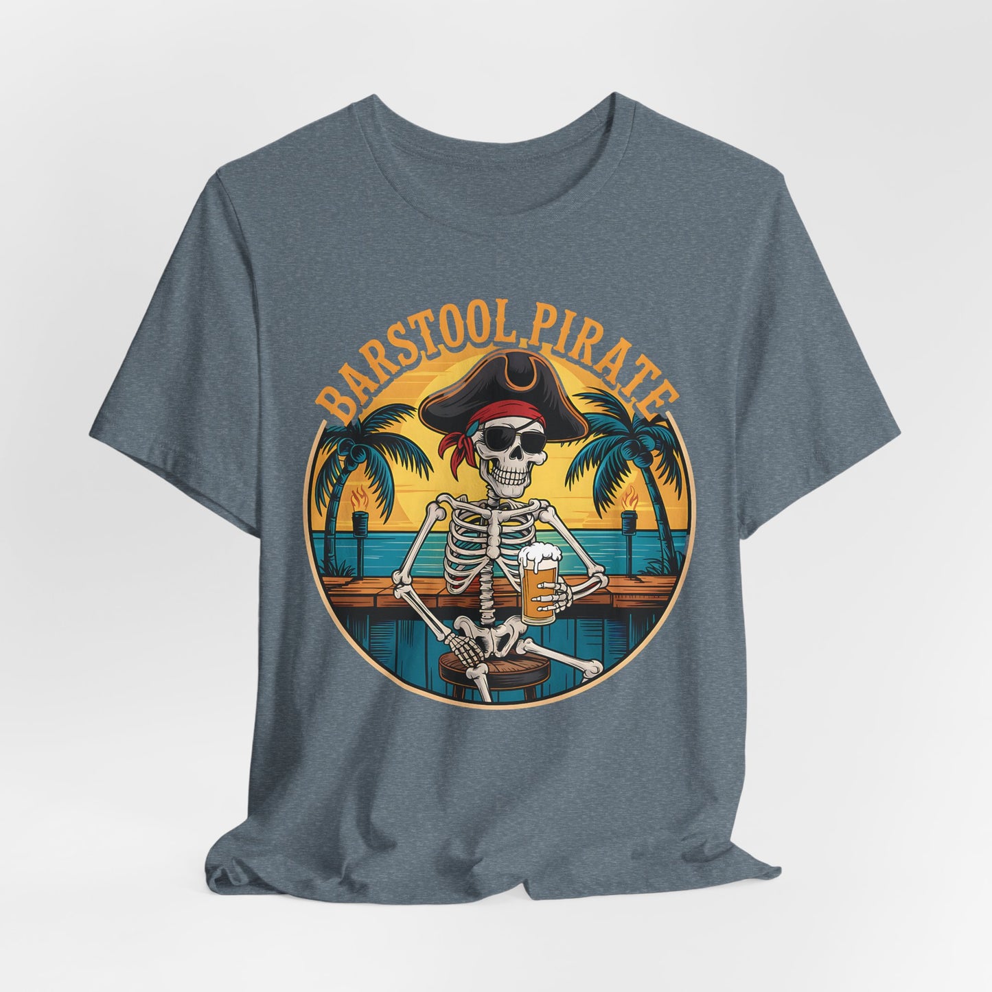The Barstool Pirate Graphic T-Shirt is a fun unisex jersey short sleeve shirt featuring a pirate skeleton at a bar with beer, palm trees, and a sunset—finished with bold yellow “BARSTOOL PIRATE” lettering.