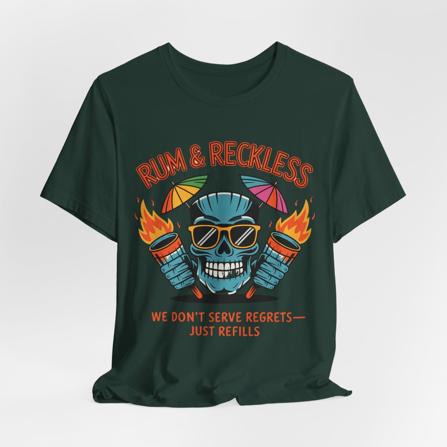 The Rum & Reckless Skull Tiki T-Shirt features a blue skull with sunglasses, flaming rum bottles, and umbrellas on dark green. Ideal unisex tee for summer parties or beach days. Text: We don’t serve regrets, just refills.