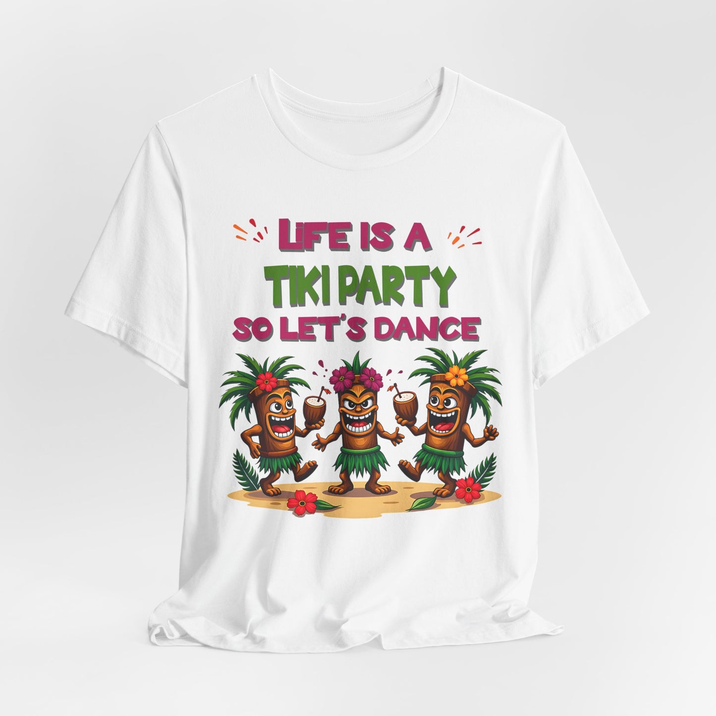 The Tiki Party T-Shirt features three dancing tikis with palm leaves and flowers under the phrase “Life is a Tiki Party, So Let’s Dance.” This fun, unisex short sleeve shirt is perfect for summer gatherings and celebrations.