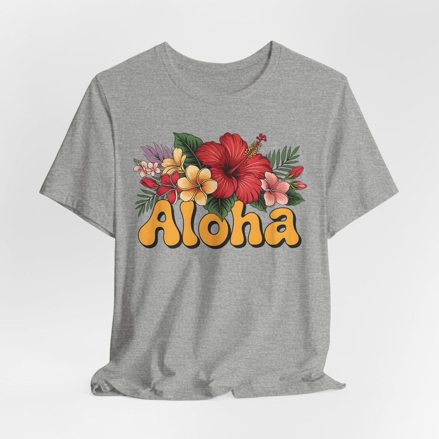 The Aloha Floral Unisex Jersey T-Shirt features vibrant tropical flowers and bold yellow Aloha lettering, crafted from soft Airlume cotton for comfort and summer style—perfect for casual, tropical vibes.