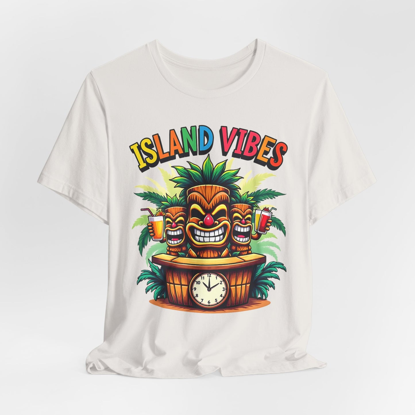 The Island Vibes Tiki T-Shirt is a unisex relaxed fit tee featuring colorful tiki faces, palm leaves, drinks, and a clock-topped barrel—ideal for tropical lovers embracing an island lifestyle.
