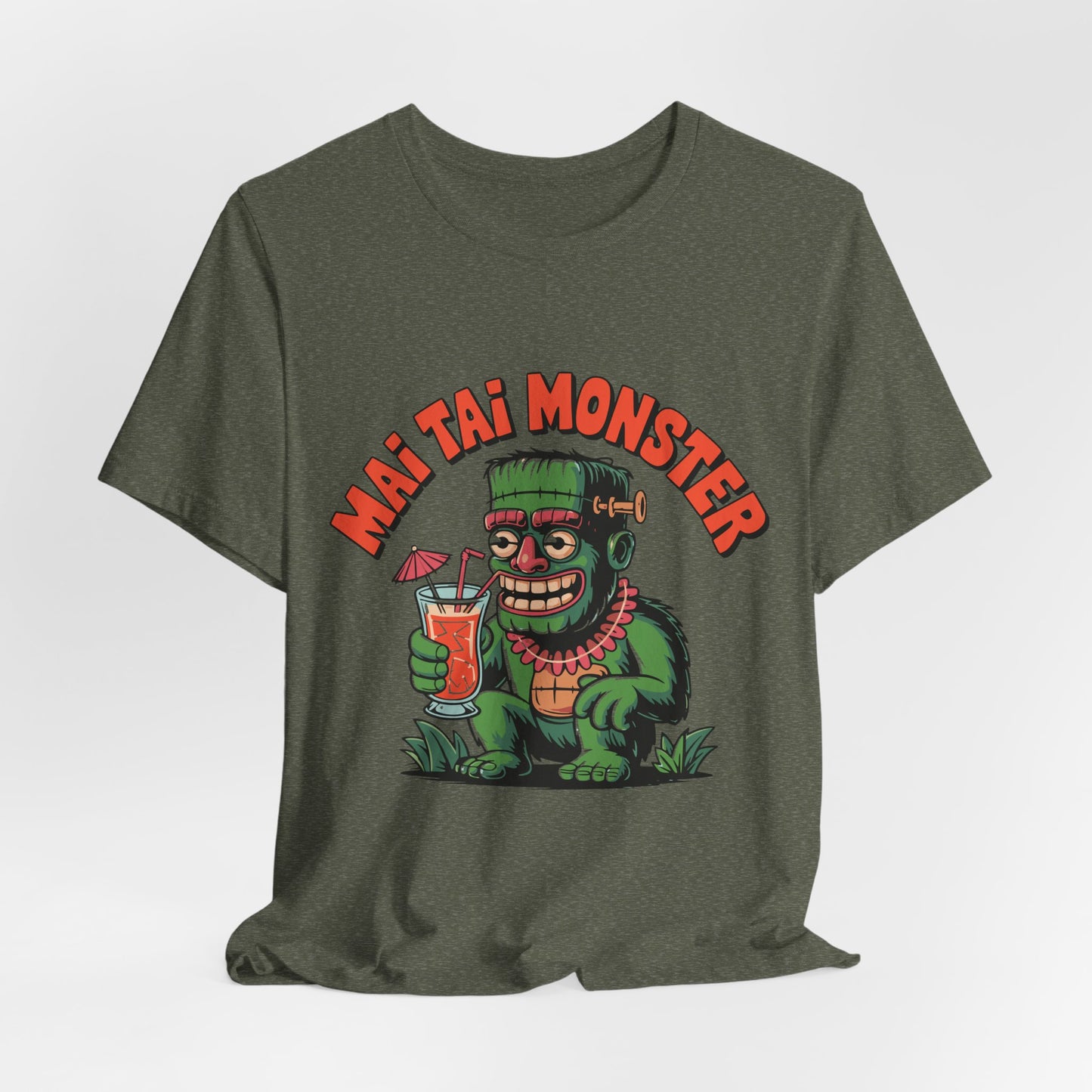 Green t-shirt with a graphic of a monster holding a drink and 'Mai Tai Monster' text on a white background