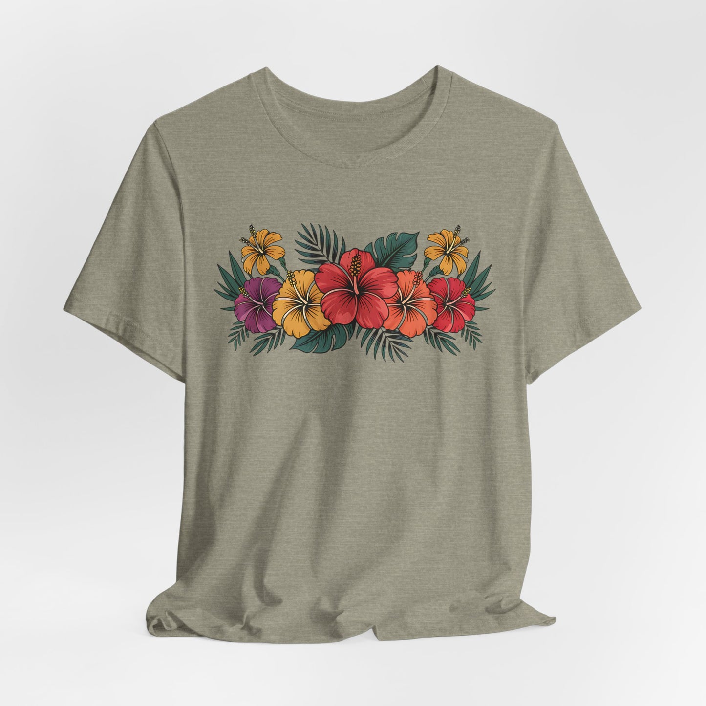 The Tropical Floral Unisex T-Shirt – Perfect for Summer Days – features a vibrant red, orange, and yellow hibiscus floral design with green leaves on light gray Airlume combed cotton.