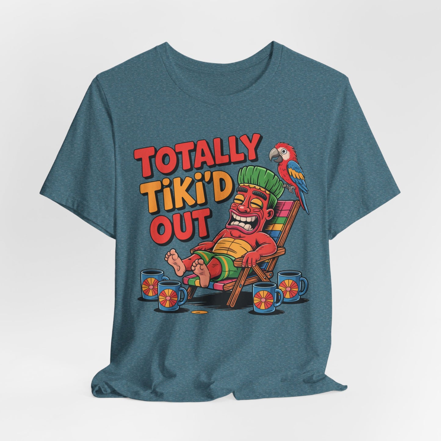 The Tiki Vibe Short Sleeve Tee features a vibrant Totally Tikid Out graphic with a cartoon tiki, drinks, and parrot—perfect for showing off your love of tiki vibes. Unisex fit and playful design for anyone who’s totally tiki’d out!.
