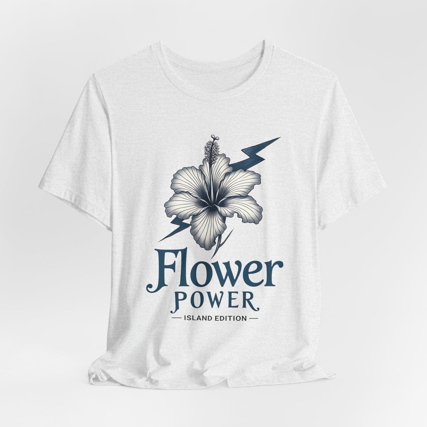 The Flower Power Graphic T-Shirt - Unisex Jersey Short Sleeve T-Shirt features a bold hibiscus flower with a lightning bolt and the phrases Flower Power and Island Edition in stylish font, capturing bright island vibes.