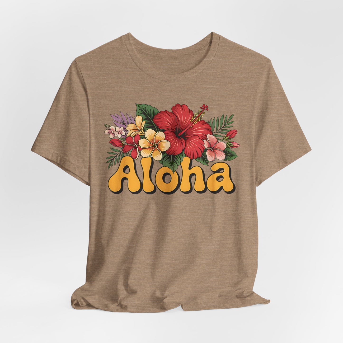 The Aloha Floral Unisex Jersey T-Shirt features colorful tropical flowers and green leaves above “Aloha” in retro yellow and brown, crafted from soft Airlume cotton for casual summer style and all-day comfort.