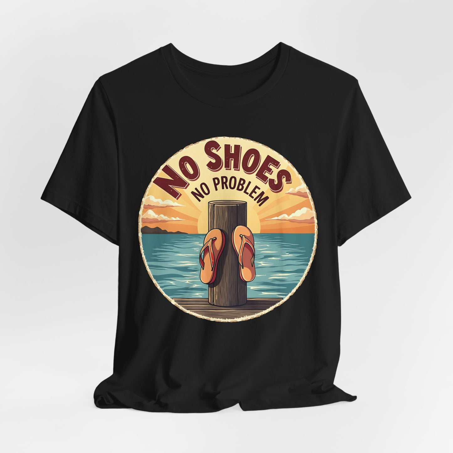 The Unisex No Shoes No Problem Graphic Tee is a casual beach vibe shirt featuring orange flip-flops on a wooden post by the water at sunset—perfect for anyone who loves a laid-back coastal lifestyle.