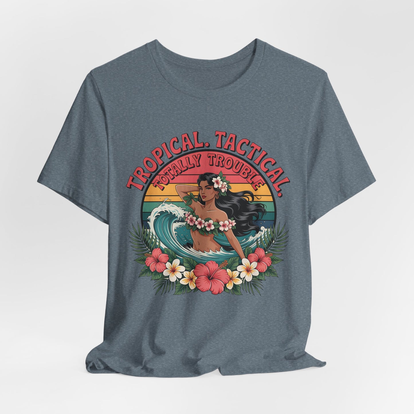 The Tropical Tactical Unisex Jersey T-Shirt - Aloha Vibes & Summer Fun features a hula dancer in a flower crown with tropical flowers and leaves, plus Tropical Tactical above and Totally Trouble below.