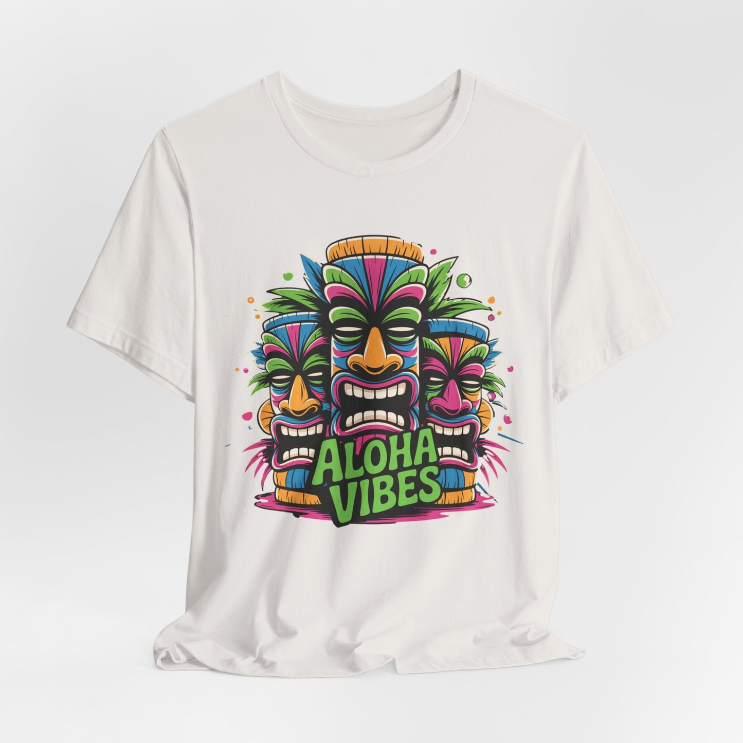 Stay cool in the Aloha Vibes Unisex Short Sleeve Tiki T-Shirt, a breathable cotton tee with three colorful tiki masks and Aloha Vibes in bold green and purple—a perfect tropical graphic t-shirt for beach lovers and summer festivals.