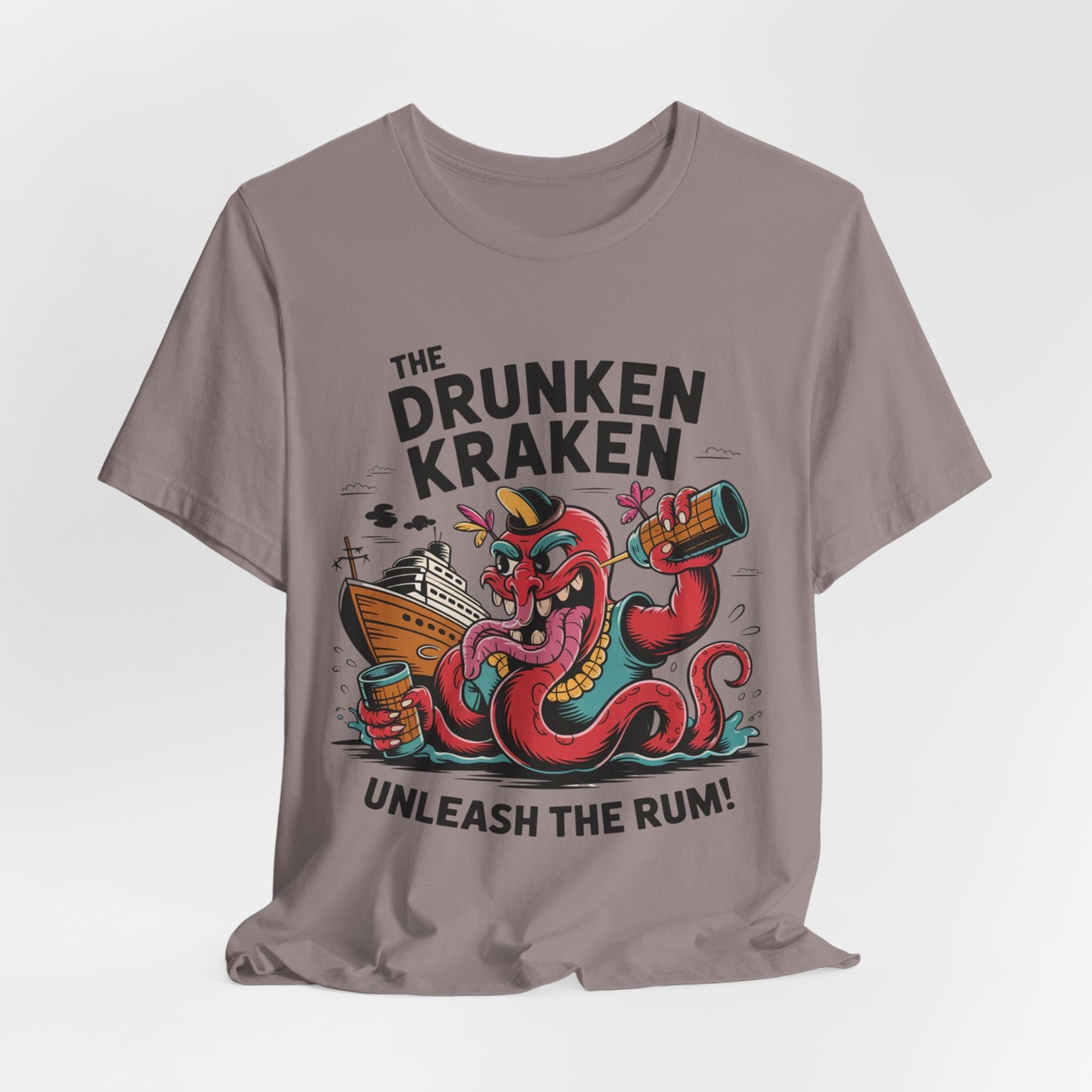 The Drunken Kraken Unisex Tiki T-Shirts – Unleash the Rum Graphic features a cartoon kraken with rum mug and ship, nautical mischief, and the text THE DRUNKEN KRAKEN above, UNLEASH THE RUM! below the colorful design.